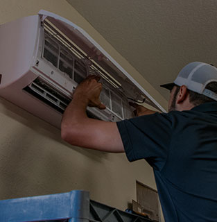 technician doing air conditioner repair services