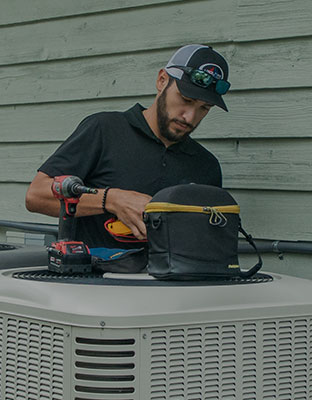 technician performing residential air conditioning repair